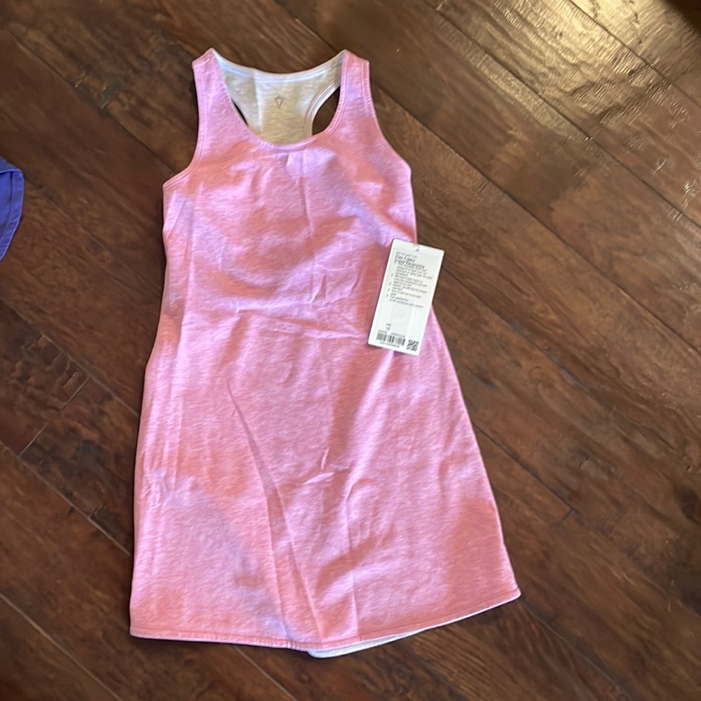Adorable ivviva/Lululemon girls size 10. 
Pink/gray reversible dress is NWT $75
